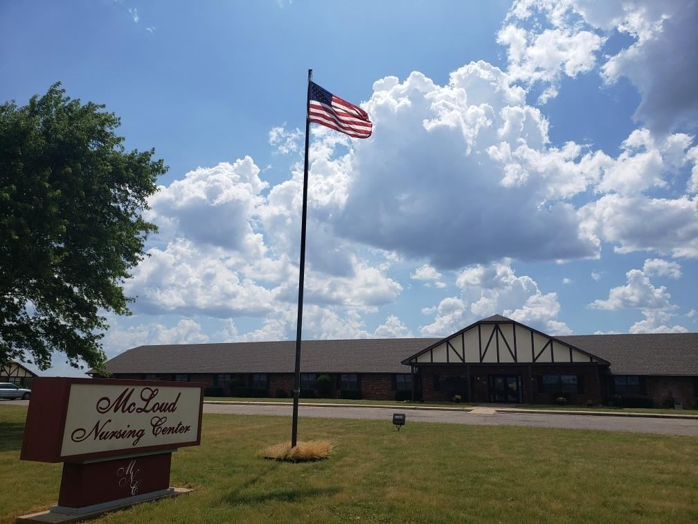 McLoud Nursing Center sign and flagpole in McLoud, Oklahoma